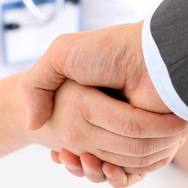 Female medicine doctor shake hand as hello